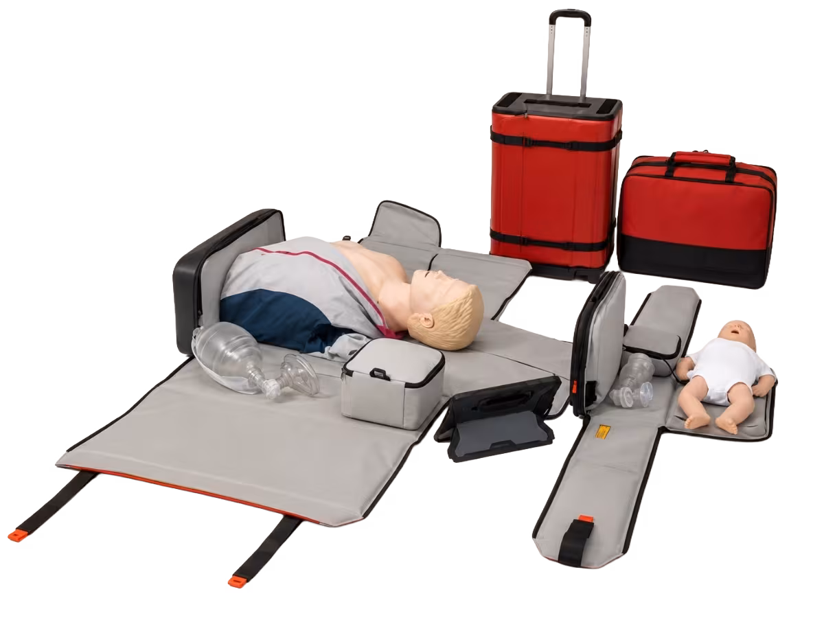CPR Go-Kit training equipment with adult and infant manikins, travel cases, and training mats